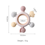 Baby teething ring with measurements on a white background