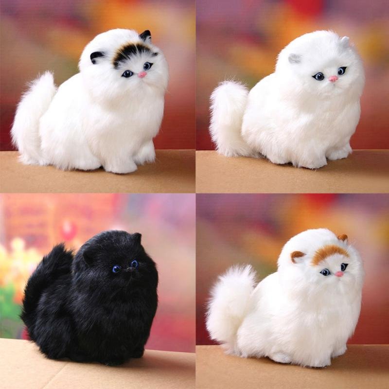 Four plush cat toys in different colors on a blurred background