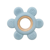 Blue teething ring with wooden center on a white background