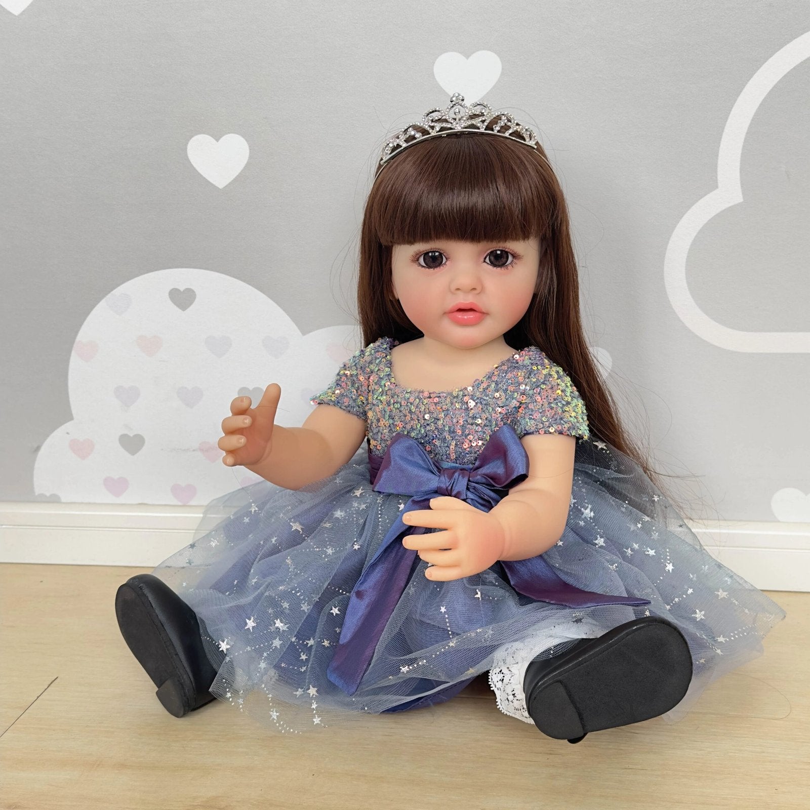 22-inch full body Princess Betty toddler doll with tiara and long hair for dress-up play and collecting.