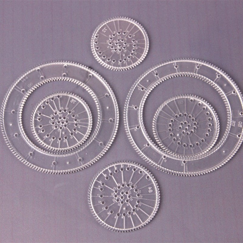 Geometry art rings from the 22pcs Spirograph drawing set for teaching circles, curves and symmetry through art.