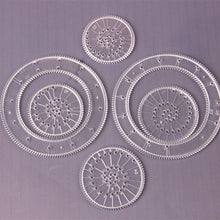 Geometry art rings from the 22pcs Spirograph drawing set for teaching circles, curves and symmetry through art.