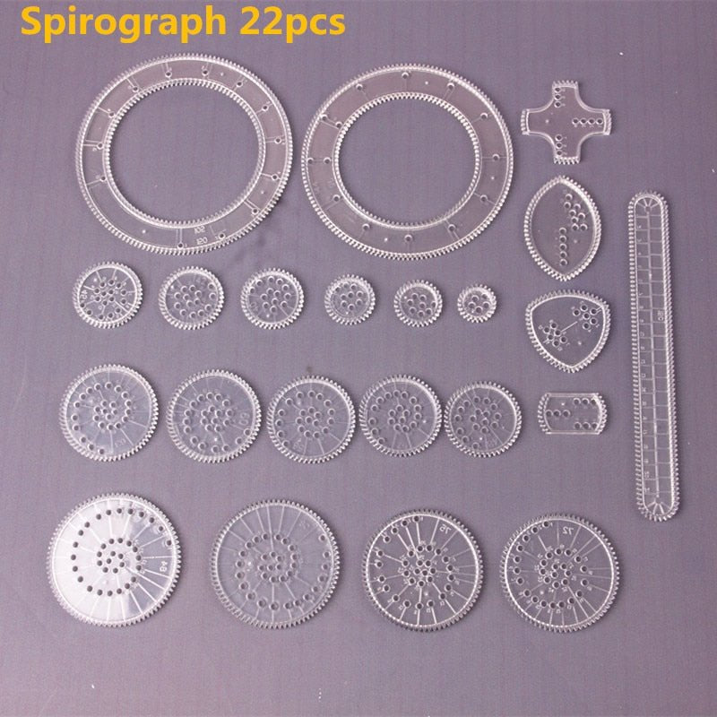 Spirograph pattern maker drawing toy parts laid out ready for creative sessions at the kitchen table.