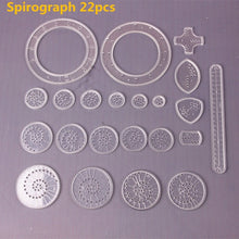 Spirograph pattern maker drawing toy parts laid out ready for creative sessions at the kitchen table.