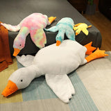 Colorful goose-shaped plush toys on a bed