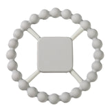 White silicone teething ring with a square handle on a white background