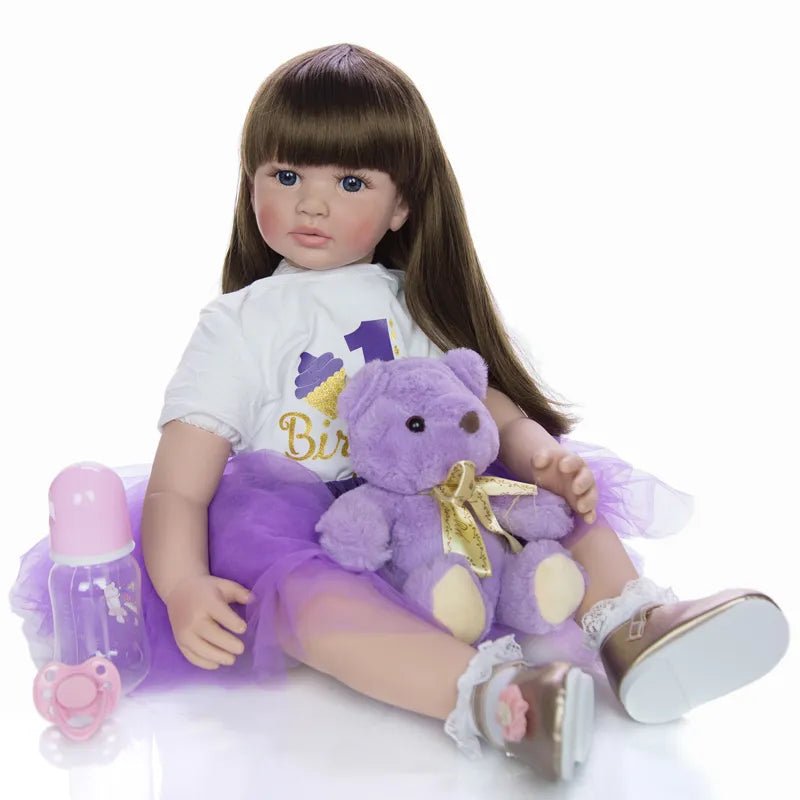 Lifelike reborn toddler princess doll with bottle and teddy accessories for feeding and caring role play.