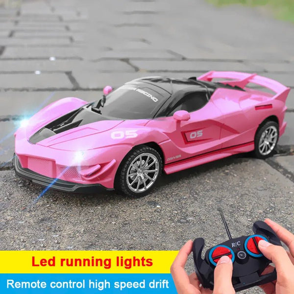 Pink 2.4G High-Speed RC Car with LED lights and remote control for kids stunt drift racing indoors.