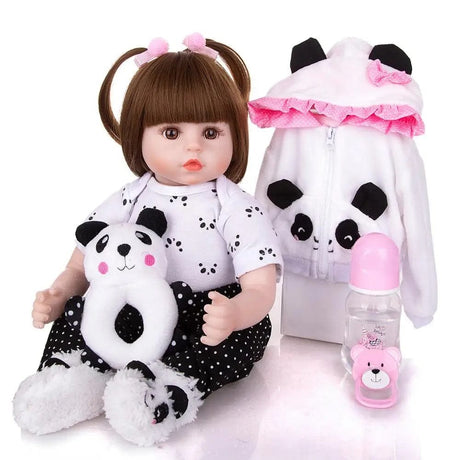 Baby doll with panda outfit and accessories on a white background