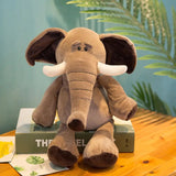 Plush elephant toy on a book