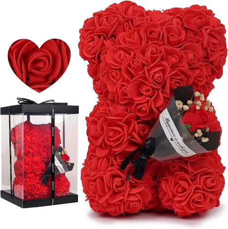 Red rose teddy bear with a heart-shaped box of roses.