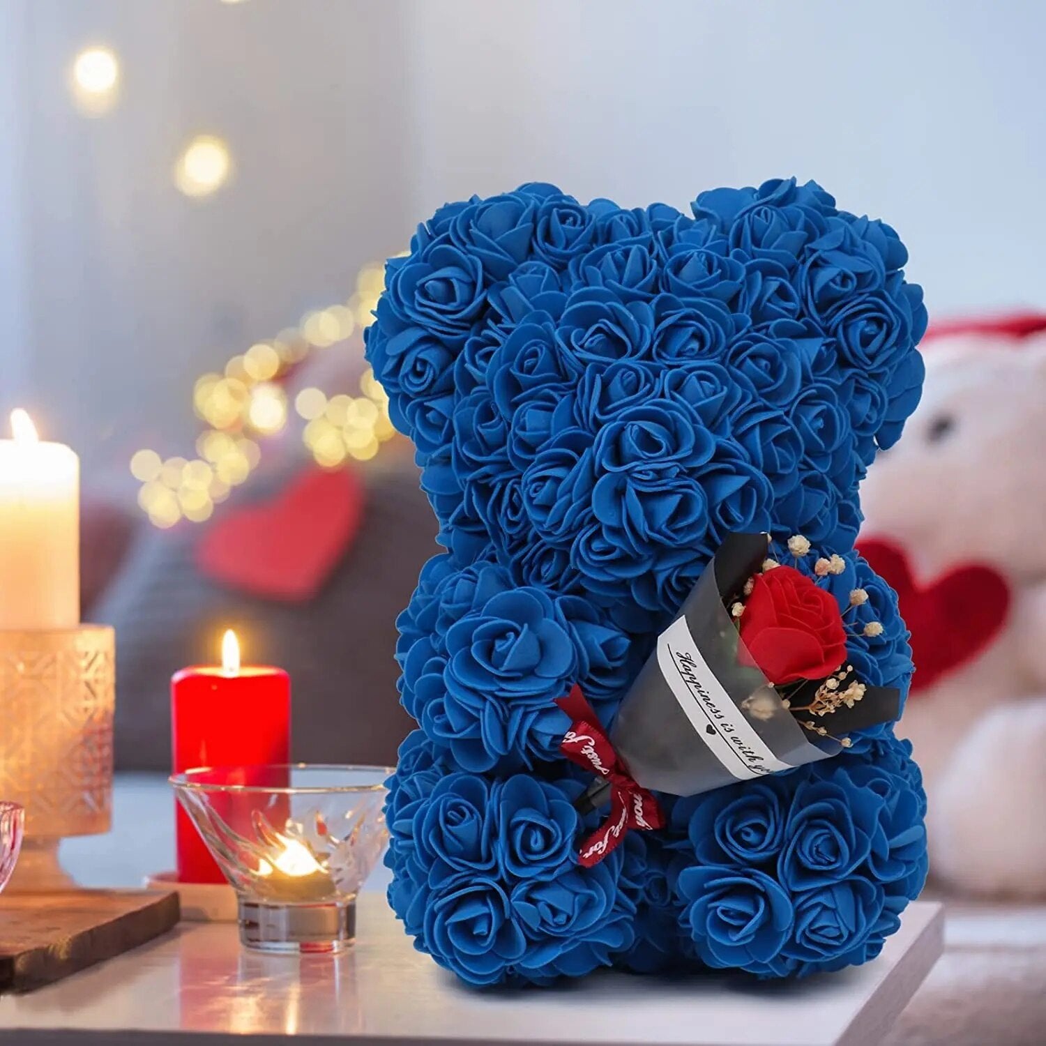 Blue Rose Bear with a heart shaped gift presentation, a romantic artificial flower teddy for Valentines Day gifting.