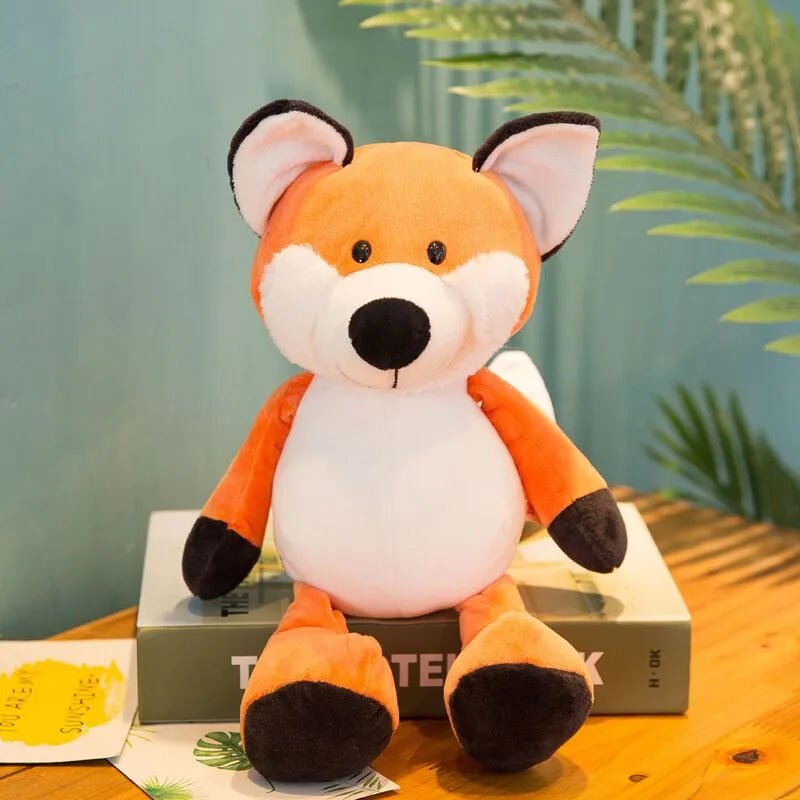Fox plush toy from the forest animal collection resting on a book, a soft stuffed friend for reading time and gifting.
