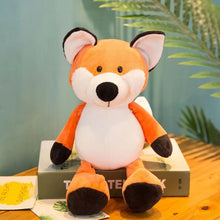 Fox plush toy from the forest animal collection resting on a book, a soft stuffed friend for reading time and gifting.