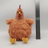 Plush chicken toy next to a ruler on a white background