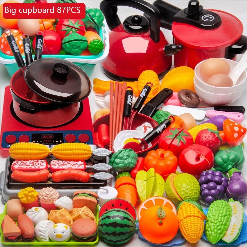 Colorful toy kitchen set with pots, pans, and food items on a white background