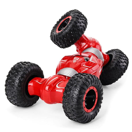 Red toy car with black tires on a white background