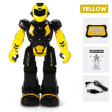 Toy robot with yellow and black color scheme, including USB cable and instruction manual on a white background.
