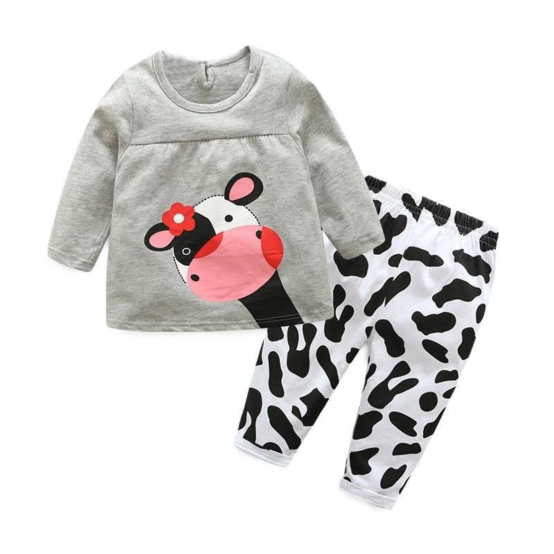 Children's outfit with gray top and cow print pants 