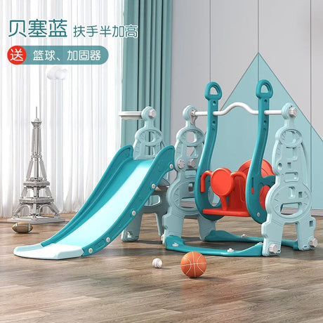 Children's playground equipment with slide and climbing structure on a wooden floor.