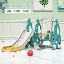 Children's playground equipment with slide and swing set on a light wooden floor.