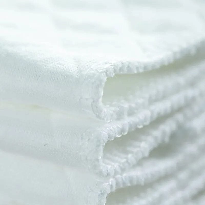Close-up of 3-layer microfiber diaper liner fabric for absorbent, breathable nappy changes and washable diaper use.