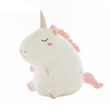 Cute unicorn plush toy with pink mane and tail on a white background