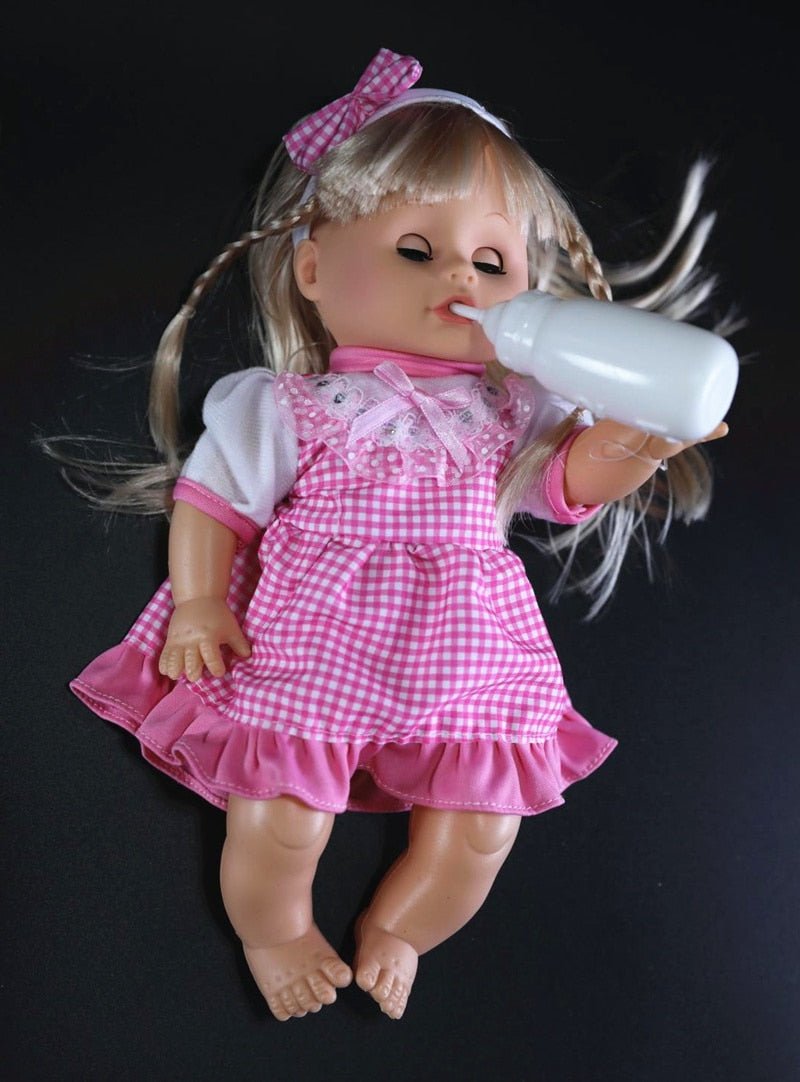 Doll in a pink dress holding a bottle.