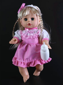 Close view of the electronic 32cm baby doll with blinking eyes and talking voice holding a bottle.