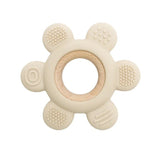 Beige teething ring with wooden center on a white background