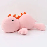Pink dragon plush toy on a white background