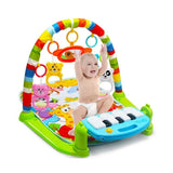 Baby playing on a colorful activity gym with toys and a keyboard.