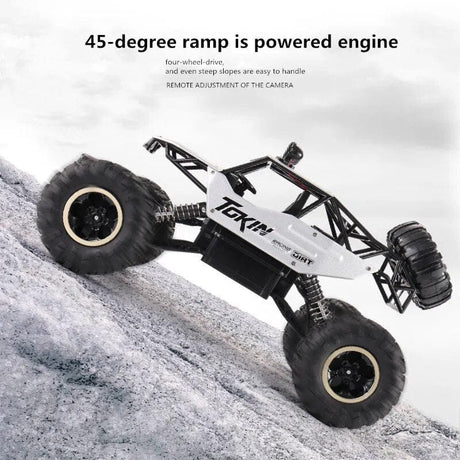 Toy truck climbing a snowy slope with text about its features.
