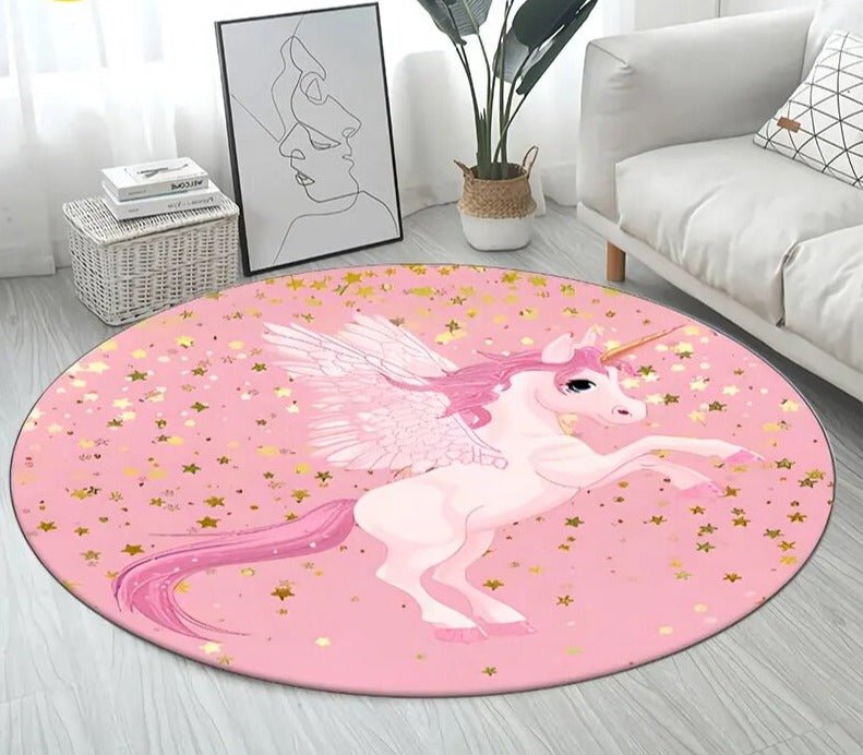 Round pink rug with a unicorn design in a room with a couch and plant.