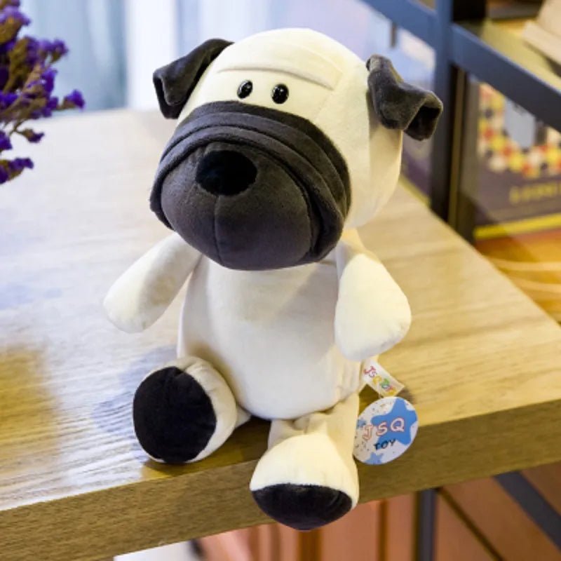 Plush dog toy with a tag on a wooden surface