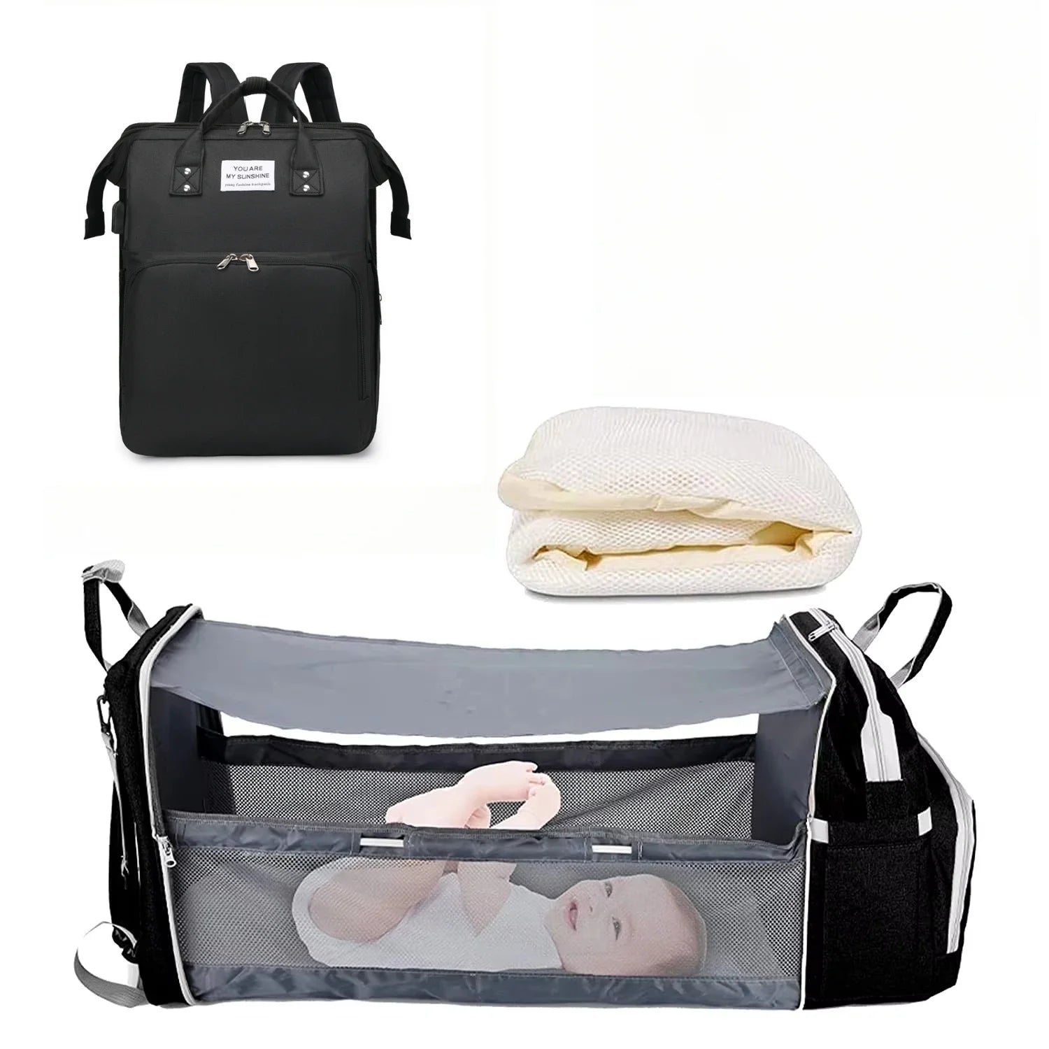Black 3-in-1 backpack with white mattress and gray foldable baby crib for portable naps while traveling.