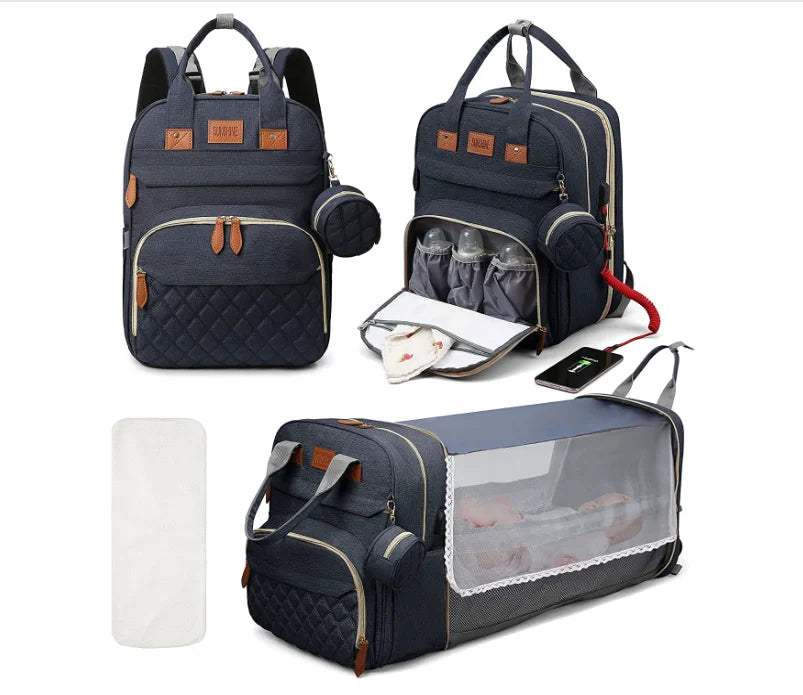 Navy blue 3-in-1 diaper backpack with multiple compartments for organized baby travel essentials.