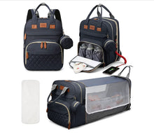 Navy blue 3-in-1 diaper backpack with multiple compartments for organized baby travel essentials.
