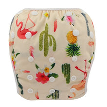 Beige cloth diaper with flamingo, pineapple, and floral pattern on a white background
