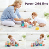 Woman and baby playing with colorful blocks on a light-colored floor.