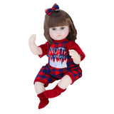 Doll wearing a red and blue outfit with a plaid pattern 
