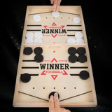 Wooden foosball table with 'Winner' branding on a black background