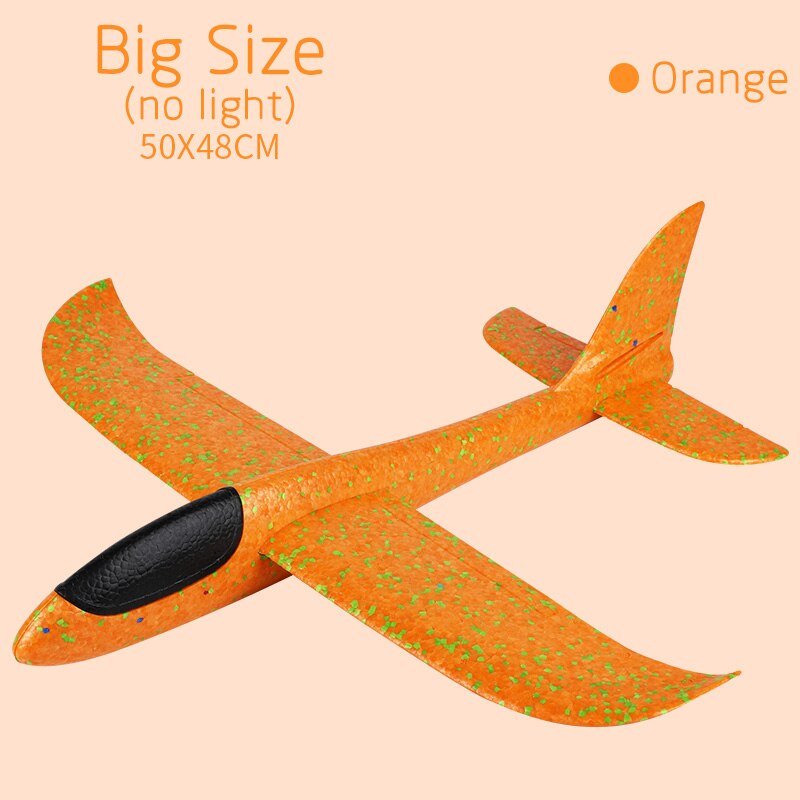 Orange inflatable airplane with green speckles.