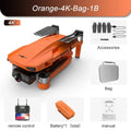 Orange underwater drone with accessories on a white background