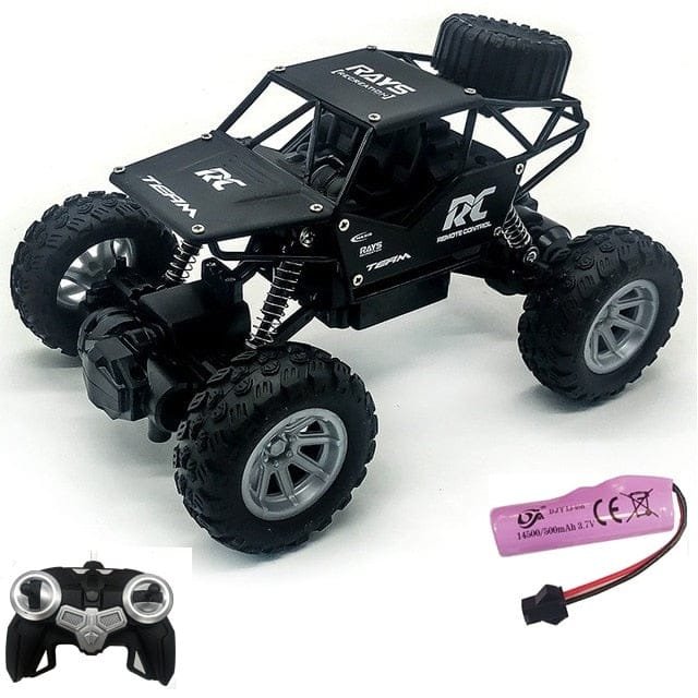 Black RC monster truck with remote control and battery.