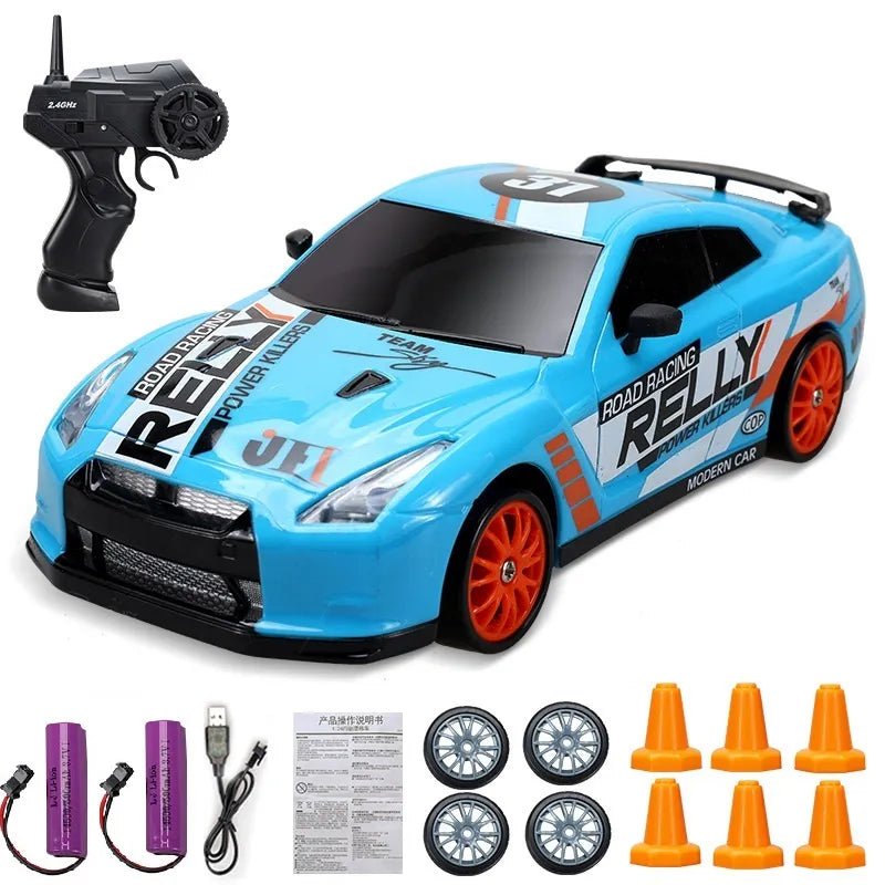 Blue toy race car with remote control, batteries, and cones