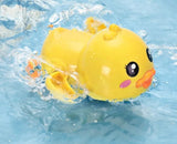 Yellow rubber duck with a smiling face in water