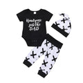 Black and white baby outfit with 'Handsome just like DAD' text on a plain background