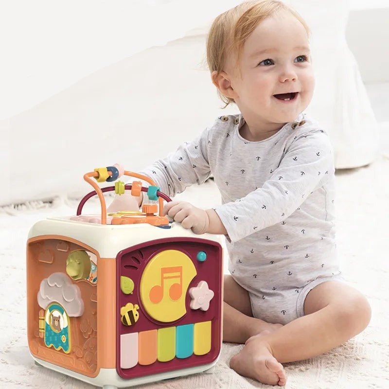 Child playing with a colorful toy cube on a light background
