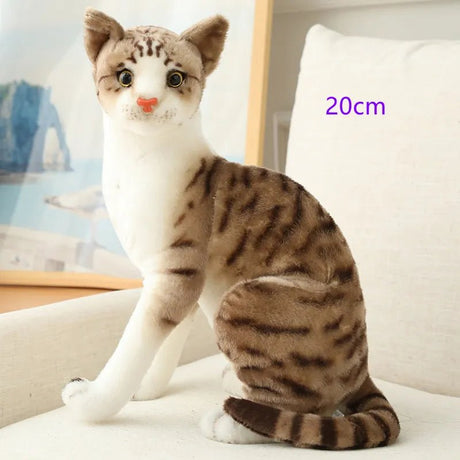 Plush toy cat with brown and white pattern on a light background